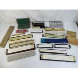 A boxed Otis King patent calculator model K, a cased set of drawing instruments,