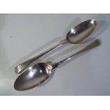 Two George III silver hallmarked spoons, London assay 1767, approximately 136 grams all in.