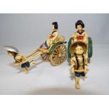 A pair of celluloid Japanese rickshaws,