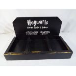 A Hogwarts Advanced Potion's Tray, Est £20 - £40.