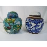 Two oriental ginger jars with lids, one in blue and white decoration,
