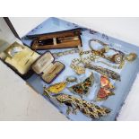 A good mixed lot of predominantly costume jewellery to include brooches, a yellow metal bar brooch,