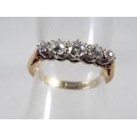 A lady's 18 carat yellow gold and platinum ring sewt with five old cut diamonds,