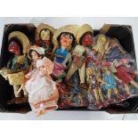 A collection of wooden Mexican dolls.