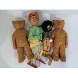 A collection of vintage toys to include two wooden puppets,