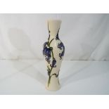 Moorcroft Pottery - A slim form Moorcroft pottery vase decorated in the 'Bluebell Harmony' pattern,