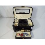 A jewellery box containing a small quantity of jewellery to include costume jewellery,