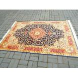 A Keshan carpet with a blue ground,