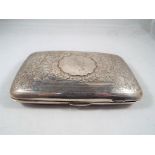 An Edward VII silver hallmarked cigar case with chased scrolling foliate decoration Chester assay