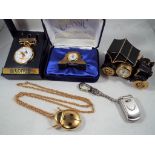 A collection of five novelty clocks and watches to include a Lorus Mickey Mouse pocket watch with