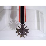 A Kriegsverdienstkreuz ( War Merit Cross with Swords 2nd class) with ribbon,