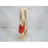 Moorcroft Pottery - A Moorcroft pottery jug decorated in the 'Harvest Poppy' pattern,
