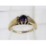 A 9 carat gold diamond and sapphire ring size M, Est £40 - £60.