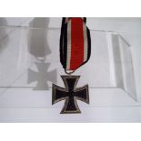 An Eisernes Kreuz 2. Klasse (Iron Cross 2nd class) with ribbon, no makers mark.