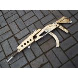 An artist's sculpture of AK47 made up of an aircraft parts, Est £30 - £50.