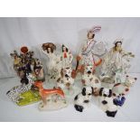 A quantity of Staffordshire pottery figurines the largest approx 40cm (h) Est £40 - £60