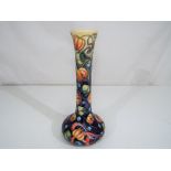 Moorcroft Pottery - a modern Moorcroft Pottery elongated vase decorated with flowers in the Celtic