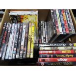 A box containing a quantity of DVD, predominantly feature films and sitcoms.