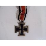 An Iron Cross Second Class with ribbon