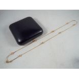 A 9 carat yellow gold necklace in a box, approximate weight 4.62 g, Est £40 - £60.