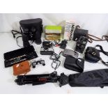 A quantity of photographic and optical equipment to include cameras by Minolta, Kodak,