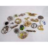 A collection of 20 predominantly vintage brooches to include makers by Carolee, A&S,