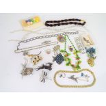 A good mixed lot of vintage costume jewellery to include bracelets, brooches, necklaces and similar,