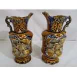 A pair of ceramic jugs with a Clyde floral decoration stamped 725 to the base approx 17cm (h) [2]