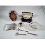 A small quantity of silver items to include an oval photograph frame, silver mounted salt,