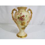 Royal Worcester - a Royal Worcester twin handled baluster form vase - urn shape 1927,