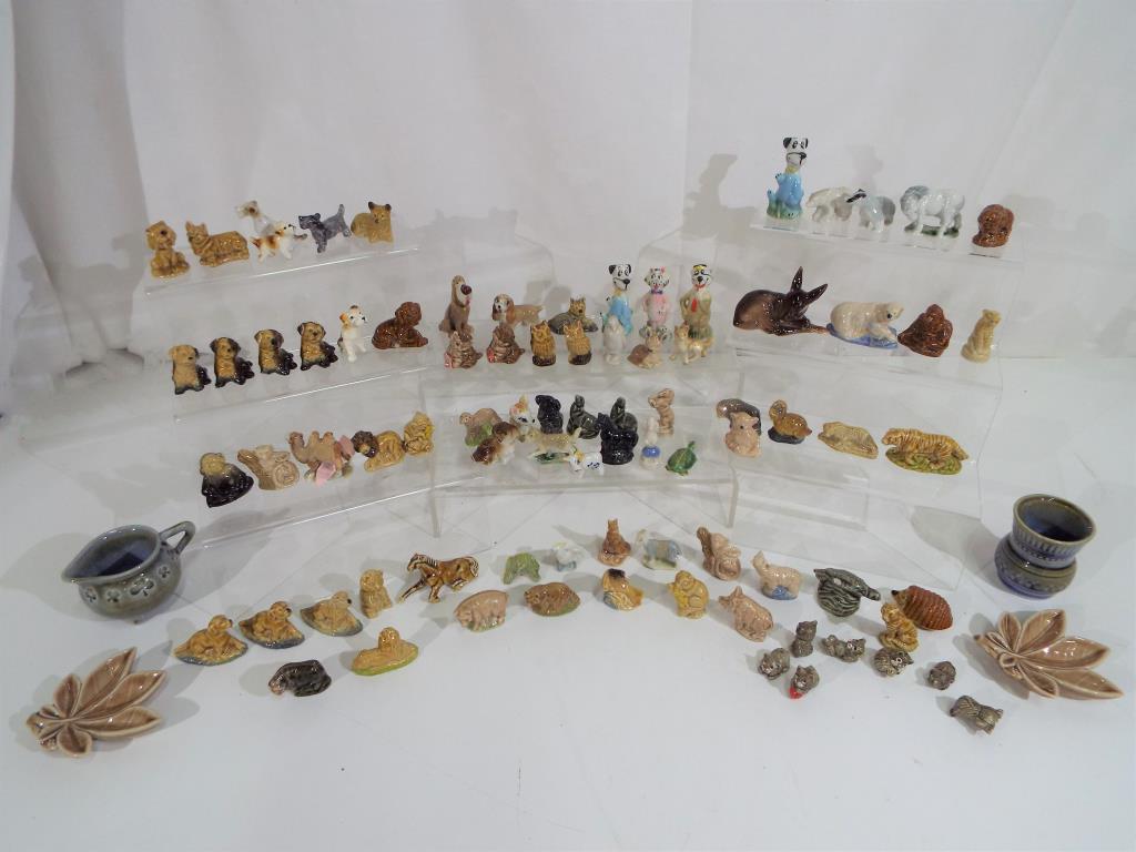 A large quantity of Wade and similar figurines to include Disney models and others predominantly