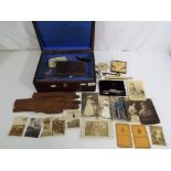 A lot to include wooden box, containing a quantity of vintage postcards and ephemera,