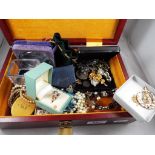 A jewellery box containing predominantly costume jewellery to include rings, brooches, bangles,