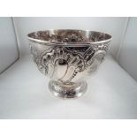 A Victorian silver hallmarked bowl with repousse decoration London assay 1896 approx 13cm (h) x 16.