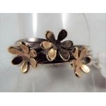 Lisa Meadmula - a hand made designer ring with a floral design,