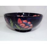 Moorcroft Pottery - a Moorcroft Pottery pedestal bowl decorated with anemone to the interior and