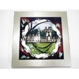 Moorcroft pottery - a frame Moorcroft pottery Balmoral plaque, measuring approximately 19 cm x19 cm,