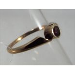 A Lady's 8 carat gold ring stone set with garnet stamped 333 size P 1/2, approximate weight 2.