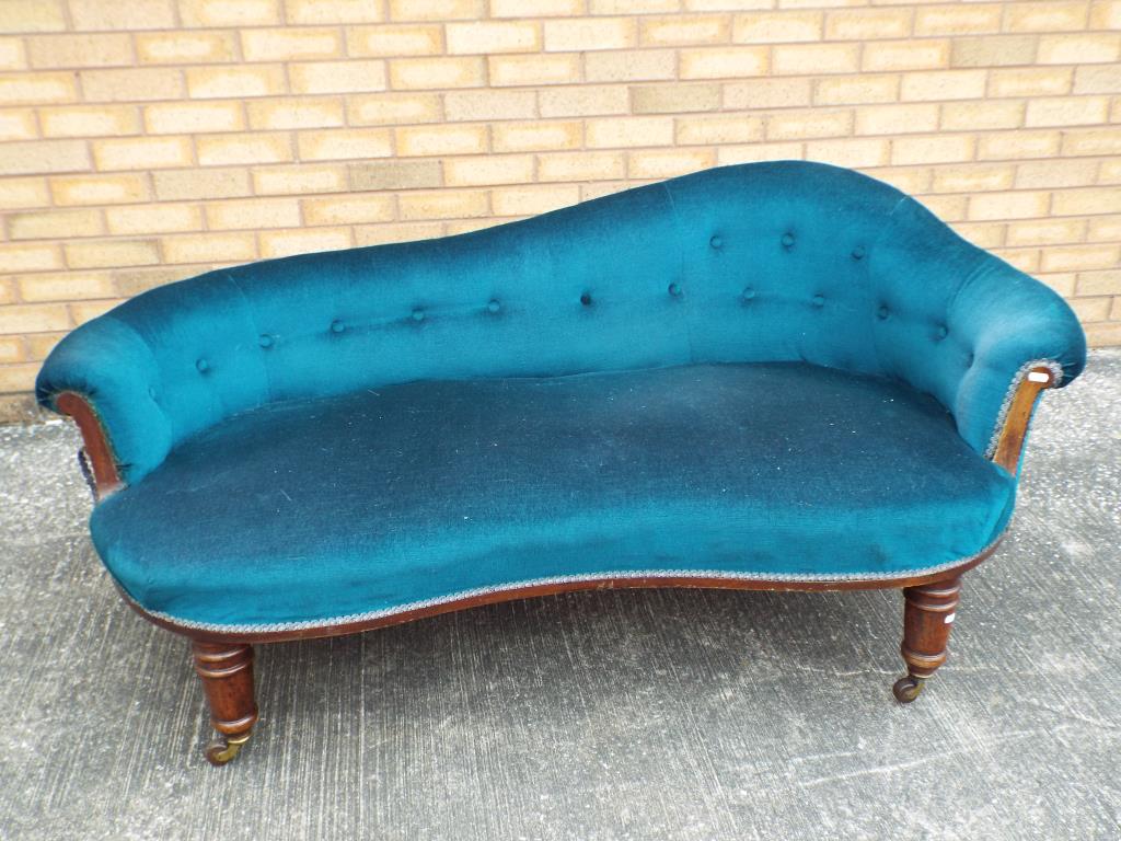 Mahogany framed Chaise Longue with a scroll end and backrest covered in button upholstered blue