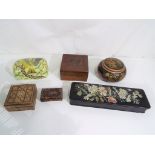 A collection of storage and trinket boxes to include inlaid wooden variety,