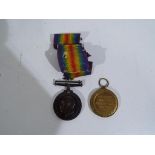 A World War One (WW1) campaign medal group - British War medal and Victory medal inscribed to the