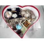 A box containing a quantity of predominantly white metal and silver jewellery,