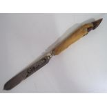 A white metal cheese slice with chased decoration with handle in the form of a deer hoof approx