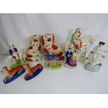 Nine Staffordshire pottery figurines the largest approx 30cm (h) Est £40 - £60