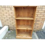 A pine bookcase approx 114cm x 61cm x 31cm