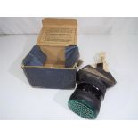 A World War II (WWII) gas mask in a box Est £20-30