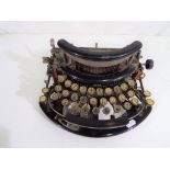 An early 20th century typewriter by Imperial with an unusual operating mechanism - Est £20 - £30