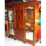 A late Victorian mahogany breakfront triple wardrobe,