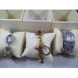 Three Lady's evening wrist watches, marked to the Mother of Pearl face Watch Company, with boxes,