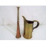 A World War I (WWI) trench art jug constructed from a 13lb shell with a commemorative copper and